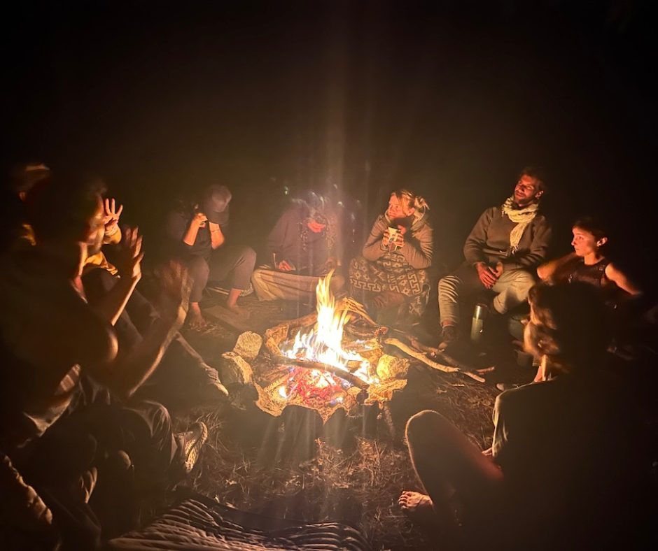 3 Educators around the campfire
